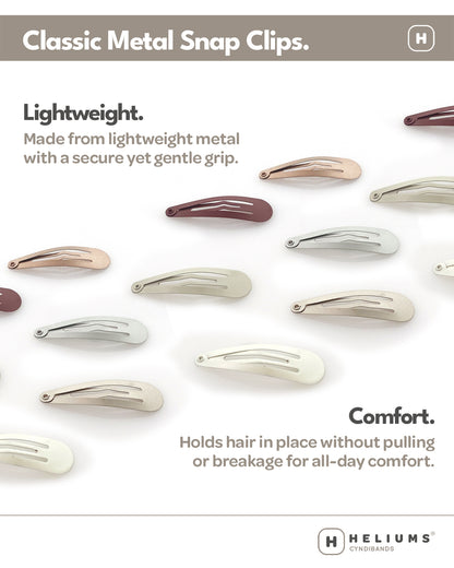 Collection of classic metal snap clips on a white background with Heliums branding.