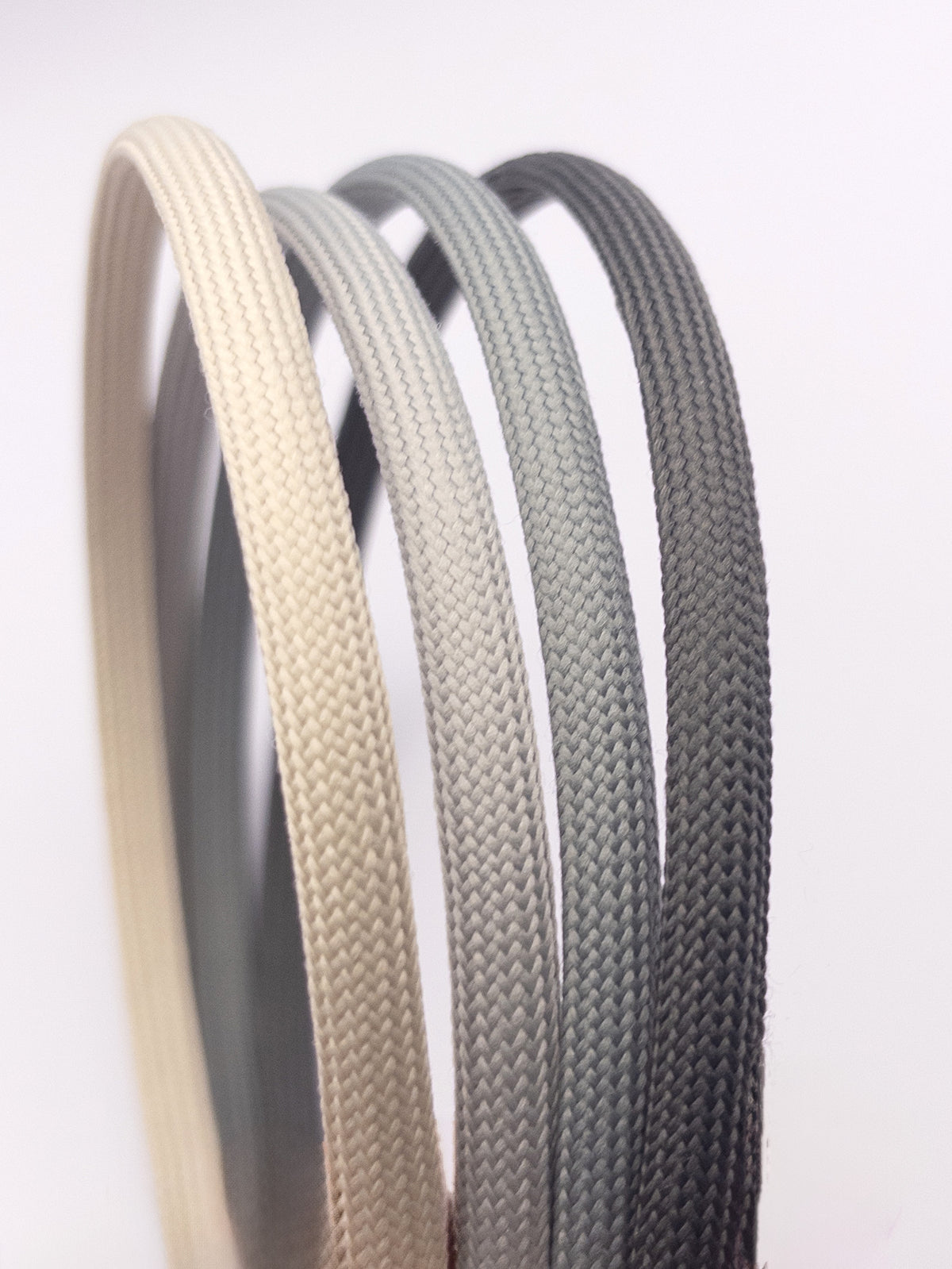 4 headbands close up in gray and off white shades