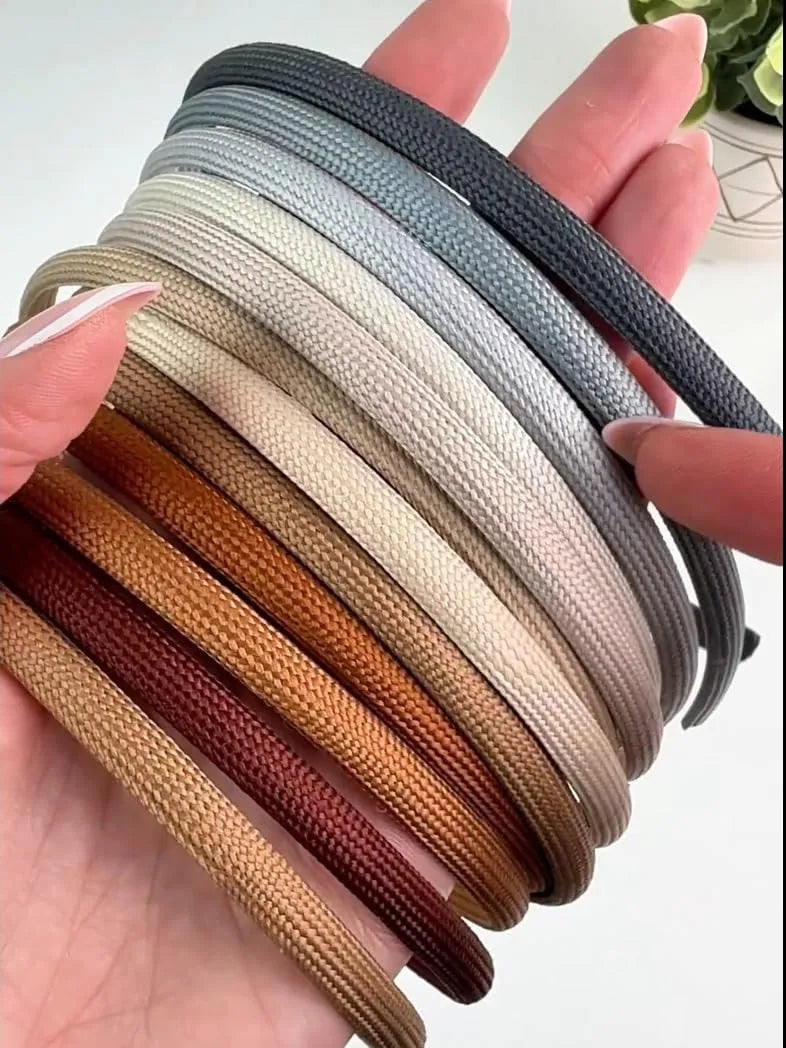 Headbands shown in various shades of gray, cream, brown and ginger colors