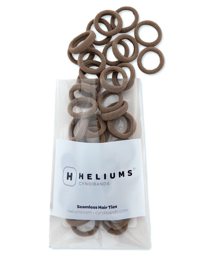 Pack of Heliums Extra Small Seamless Hair Ties in light brown color on a white background