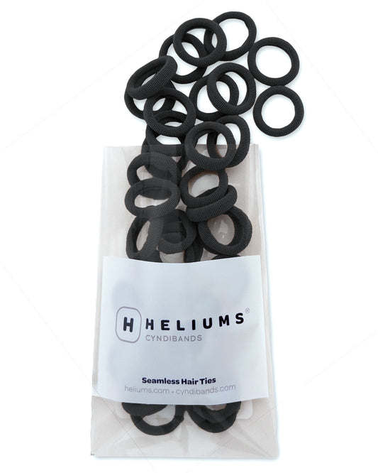 Pack of Heliums Extra Small Seamless Hair Ties in black on a white background