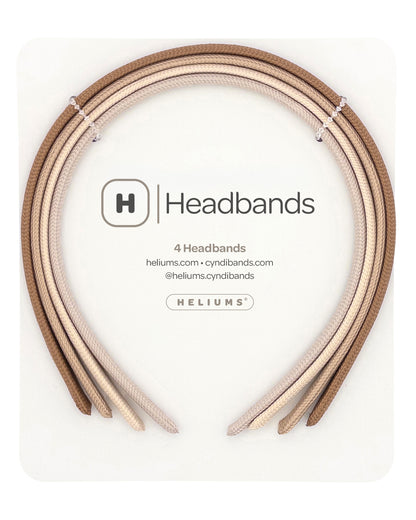 Four headbands in neutral shades of light brown, beige, cream, and light tan, neatly presented on a white backing card with the description 'Headbands' and 'HELIUMS' printed on it.