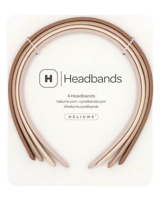 Four headbands in neutral shades of light brown, beige, cream, and light tan, neatly presented on a white backing card with the description 'Headbands' and 'HELIUMS' printed on it.