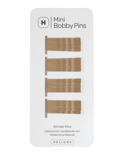 Helium Mini Bobby Pins set of 40 hair pins on a white backing card, showing four rows of dark blonde metal bobby pins.