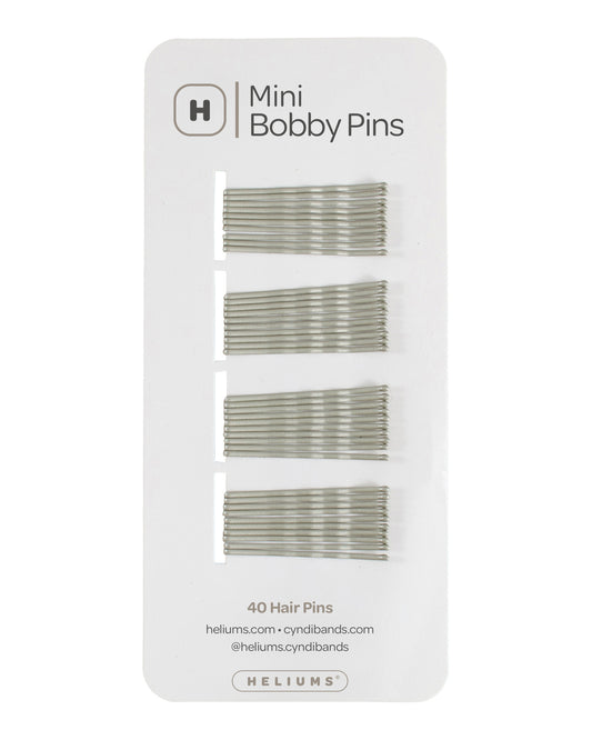 Heliums 40 mini bobby pins in a set of gray metallic color, mounted on a white backing card with the brand logo and product details.