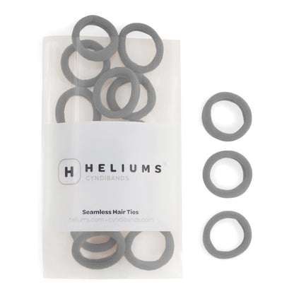 Heliums small seamless hair ties in gray, shown in a pack and individually