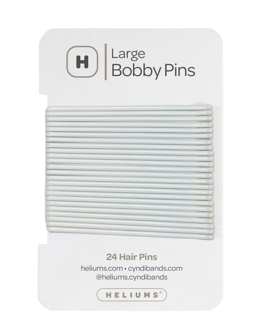 Heliums 24 Bobby Pins in a white color, packaged on a white backing card with the Heliums logo.