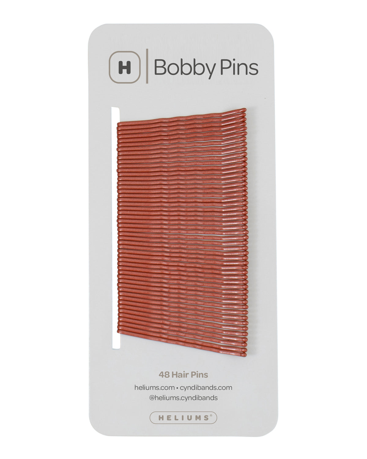 Packaging of Heliums brand 2-inch wavy auburn color bobby pins, displaying multiple pins on white card with the brand logo and name.