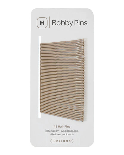 Packaging of Heliums brand 2-inch wavy dark blonde color bobby pins, displaying multiple pins on white card with the brand logo and name.