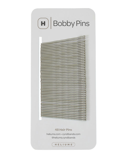 Packaging of Heliums brand 2-inch wavy gray color bobby pins, displaying multiple pins on white card with the brand logo and name.