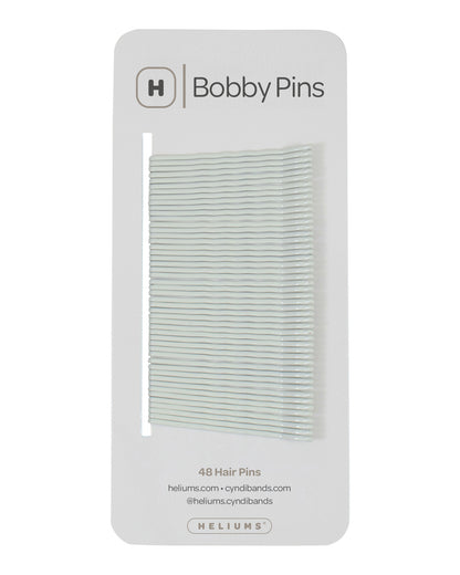 Packaging of Heliums brand 2-inch wavy white color bobby pins, displaying multiple pins on white card with the brand logo and name.